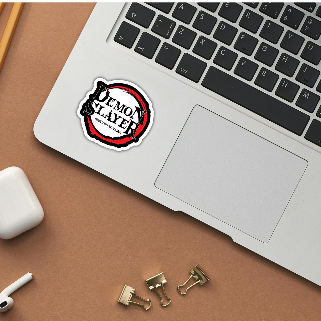 Demon Slayer sticker applied to a laptop