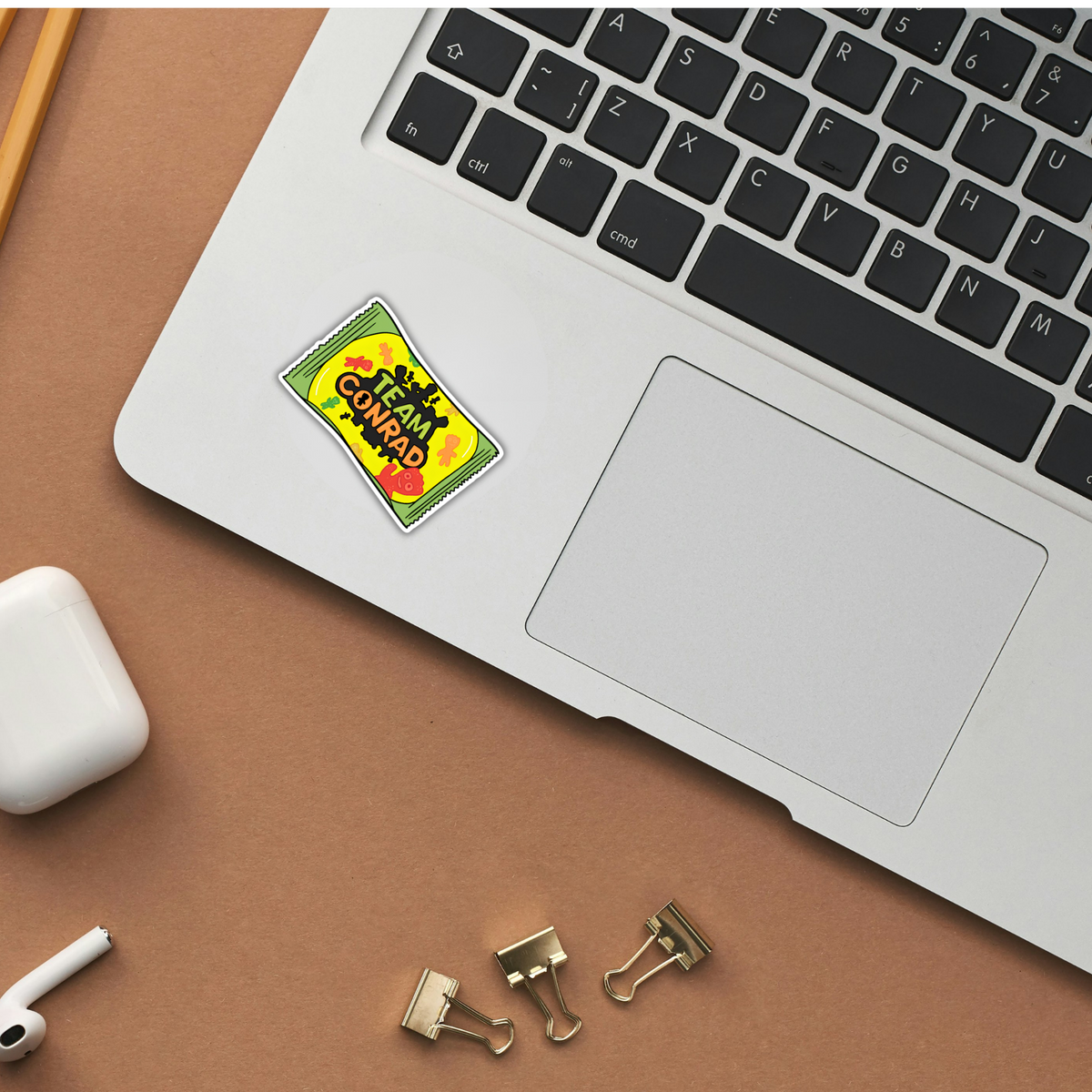 Team Conrad gummy candy pack sticker on laptop
