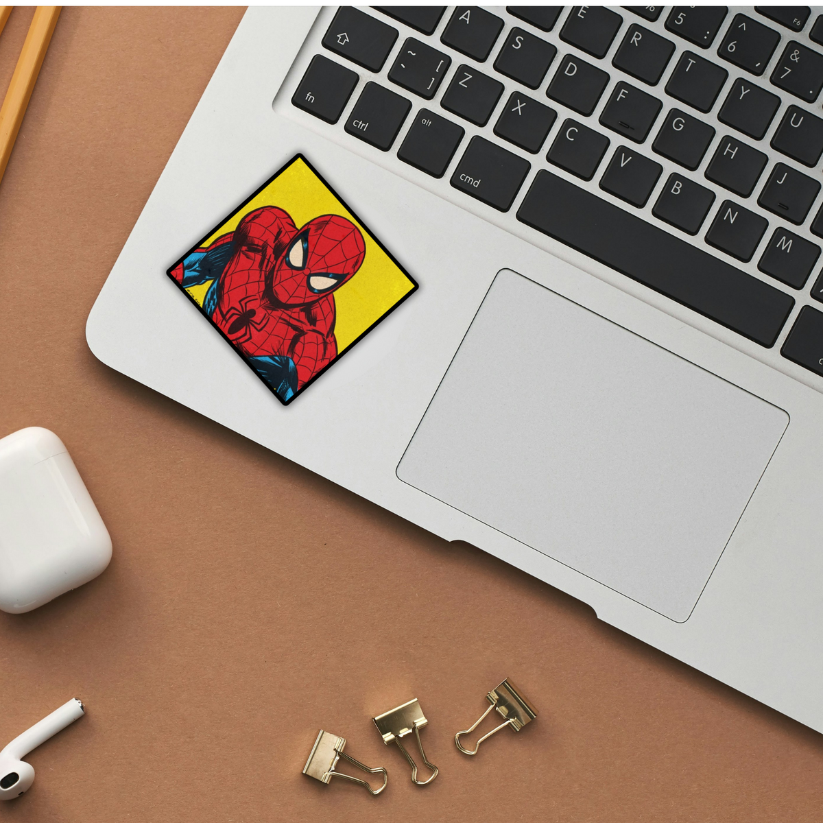 Spider-Man retro yellow pop art sticker on laptop