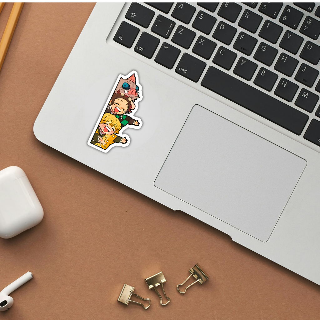 Demon Slayer trio sticker applied to a laptop