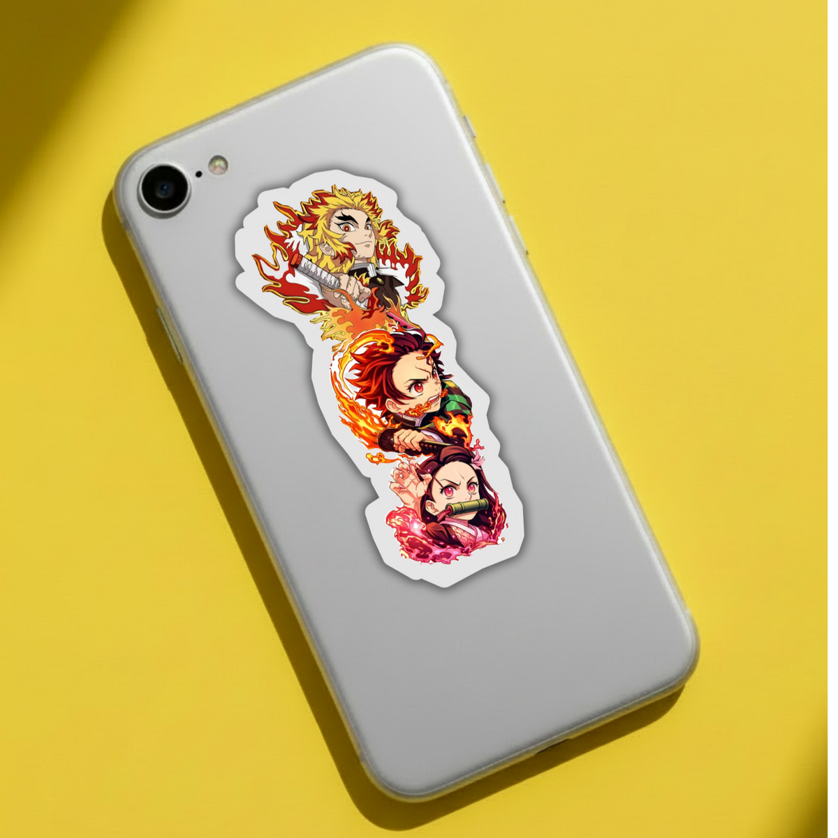 Demon Slayer flame trio sticker applied to a laptop